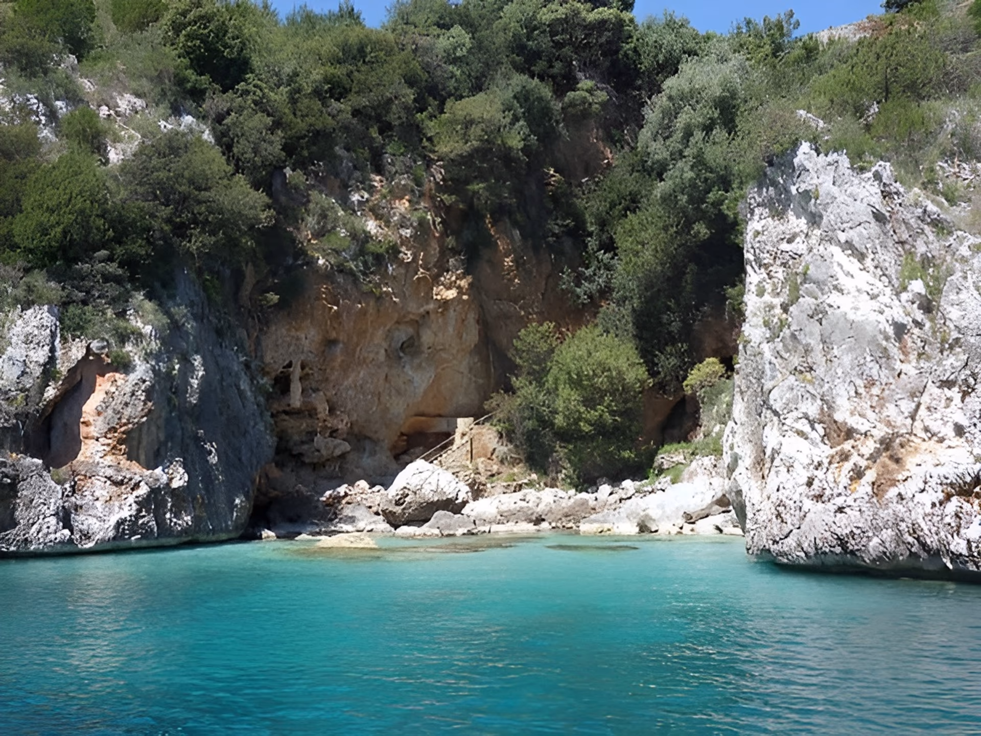 Baia degli Infreschi with clear water and rocky coastline